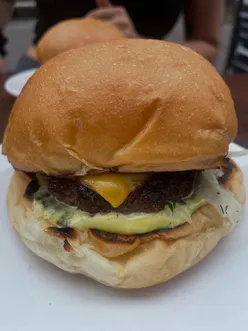 Delicious smash burger at Eat Lagom in Hackney Church Brew Co, enjoyed by locals without ketchup.