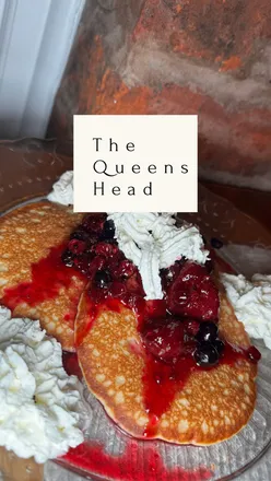 Dining at Heads Queen Pub with vibrant burgers, creamy starters, and decadent desserts in a cozy atmosphere.