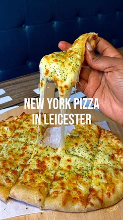 Delicious New York style pizza slices at Pitfire Slice Bar in Leicester, featuring fresh ingredients and homemade sauces.