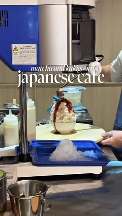 Enjoying fluffy kakigori at Hinaga, a new Japanese café in Fitzrovia, London with a serene atmosphere.