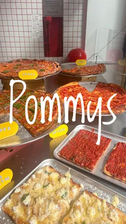 Delicious cacio e pepe pizza slice with ricotta and Parmesan at Pommy's Pizza, a top Brighton hotspot.