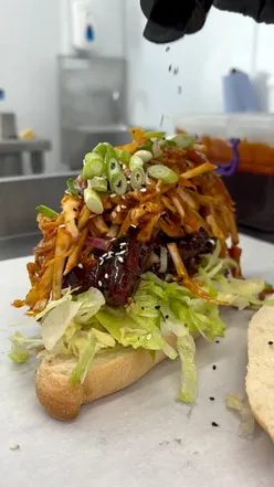 Delicious sandwiches and lattes at Reuben's Shop in Brighouse, featuring Korean Chicken and the classic Reuben.