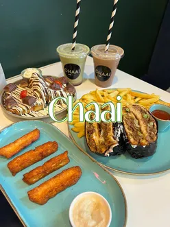 Brunch spread at Chaai in Leeds featuring breakfast dishes, toasties, and desserts.