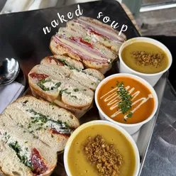 Customers enjoying sun-dried tomato soup and chicken aioli bagel at Naked Soup in Glasgow's West End.