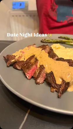 Couple enjoying a romantic homemade dinner with pasta and wine for the ultimate date night at home.