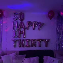 Celebrating a 30th birthday with gluten-free snacks at a cozy house party in September.