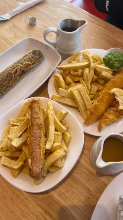 Delicious fish and chips showcased at Andy's Golden Fry chippy in Glasgow, Scotland. Perfect for food reviews!