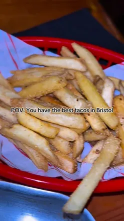 Delicious cheesy tacos at a top street food spot in Bristol, perfect for food lovers craving flavorful bites.