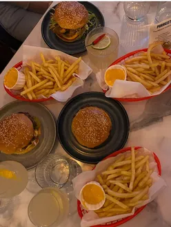 Delicious smash burgers and cocktails at Parakeet, showcasing No Drama's October takeover in West London.