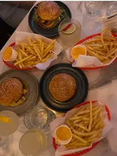 Delicious smash burgers and cocktails at Parakeet, showcasing No Drama's October takeover in West London.