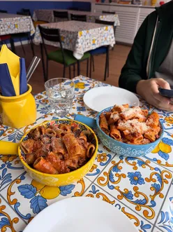 Delicious cannoli and unique pasta dishes at compà in Nottingham, featuring charming decor and a cozy atmosphere.