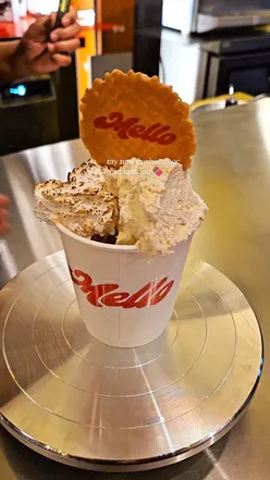 Indulgent hazelnut hot chocolate topped with torched marshmallow and whipped cream at Seven Dials Market, London.