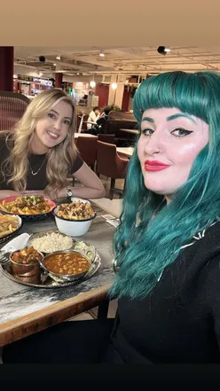 Exploring diverse cuisines at Victoria Street Collective food hall in Metquarter, Liverpool, with vibrant mocktails.