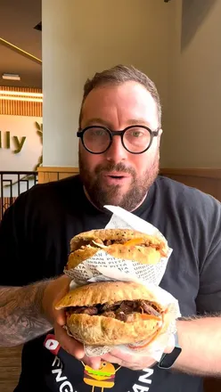 Delicious stone baked pitta from Urban Pitta in Sheffield, filled with meat, greenery, and sauces.