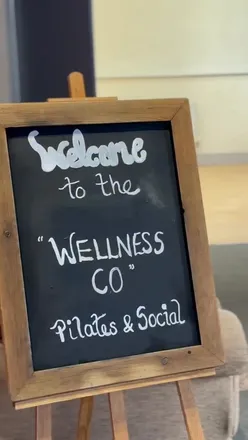 Attendees enjoying Pilates, meditation, and pumpkin lattes at The Wellness Co's Autumn Wellness Day event.