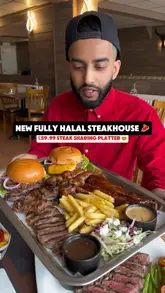 Delicious spread at Crazy Cow Steakhouse in Barking, featuring rib eye steak, chicken burger, and steak platter for sharing.