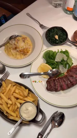 Elegant dining at Novikov in Mayfair, featuring lobster, wagyu steak, and exquisite desserts in a luxurious setting.