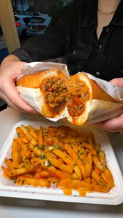 Enjoying the Scranman Special and Wings N Shrimp Combo at The Scranman in Great Barr, Birmingham.