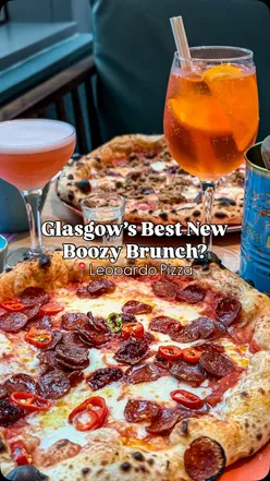 Enjoying a boozy brunch at Leopardo Pizza in Glasgow with cocktails and pizza, perfect for weekend plans!