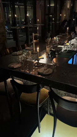 Diners enjoying a meal at Pachamama, Lagana in Shoreditch, showcasing delicious dishes and vibrant atmosphere.