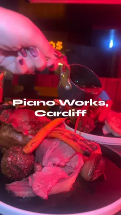 Delicious Sunday roast at The Piano Works Cardiff, featuring roast beef, chicken, and miso carrots with great live music.