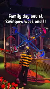 Family enjoying games, crazy golf, and delicious food at Swingers London on Oxford Street.