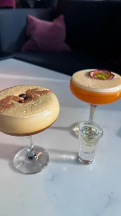 Guests enjoying a luxurious afternoon tea with views of the Clyde at Radisson RED Skybar, Finnieston Quay, Glasgow.