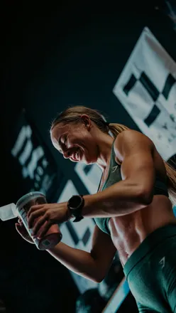 HYROX-style workout in a local gym: 20 wall balls, 12.5m sled pull, 500m run - vibrant fitness scene for local search.