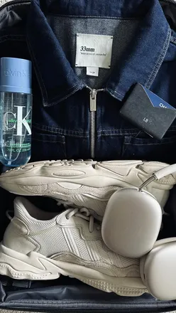 A man in his thirties enjoying charcuterie with friends, capturing quality time over good food and wine.