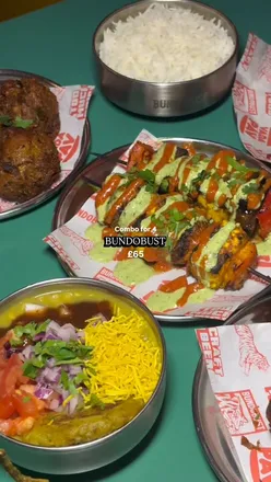 Bundobust combo for 4 featuring 11 delectable Indian dishes for sharing in a vibrant Liverpool setting.