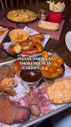 Delicious American BBQ spread at Hickory's Smokehouse in Cardiff, featuring brisket, mac and cheese, and funfair desserts.