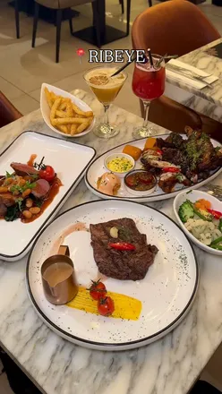 Delicious Chef's Sharing Platter featuring lamb chops and ribeye steak at Ribeye Steakhouse in Birmingham.