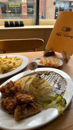 Delicious Japanese curry and ebi fry served at Gyocurry in Birmingham, featuring a cozy anime-themed ambiance.
