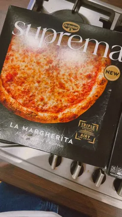 Dr. Oetker Suprema frozen pizza featuring sourdough crust and premium toppings, perfect for a cozy Saturday night.