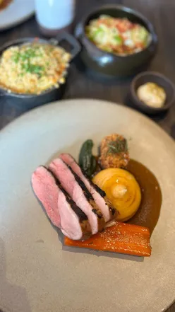 Delicious Sunday roast with katsu oysters, marmite butter, roasties, and wine at Heaneys Cardiff.