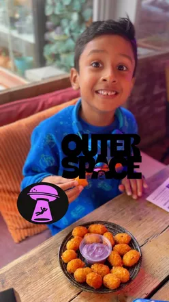 Delicious burgers at Outer Space Burger, a must-try halal spot in Manchester for foodies.
