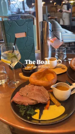 Delicious Sunday roast at The Boat featuring Scotch egg, monkfish scampi, rump beef, and chocolate mousse for dessert.