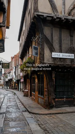Historic The Shambles in York, showcasing medieval timber-framed buildings and charming shops, a must-visit street.