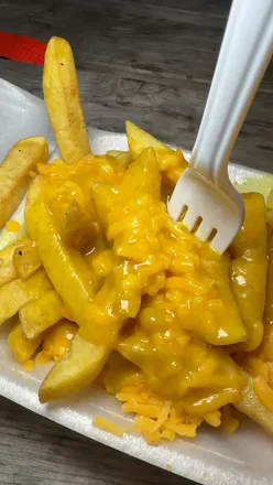 Families enjoying rides and festive activities at Spooktacular Halloween event in Glasgow.