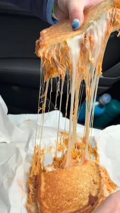 Buffalo chicken toastie and hot chocolate at The Cheesy Toast Shack, St Andrews - perfect beachside comfort food.