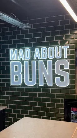 Alt text: "Delicious halal smash burgers and crispy fries at MadBuns in Cardiff, showcasing mouthwatering flavors and fluffy buns.