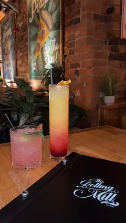 Intimate dining at The Rolling Mill, featuring Beef Garden Pizza, Miso Salmon, and specialty cocktails in the Jewellery Quarter.