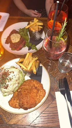 Delicious meal at The Crabtree, Fulham, featuring a vibrant atmosphere and lovely garden. Unique side salad in focus.