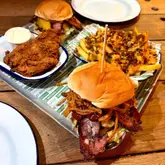 Delicious Smoky Bro Burger and dirty hot fries at Three Brothers Burgers, a unique Bristol eatery on a boat.