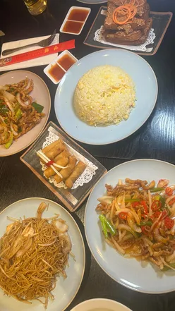 Delicious Chinese dinner at Crystal China near Tower Bridge, London, with vibrant dishes and a cozy atmosphere.