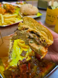 Two Bad Boy Munch Boxes featuring burgers, dynamite tenders, fries, and drinks at Mr. T's in Birmingham.