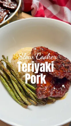 Delicious slow cooker sticky teriyaki pork with garlic and ginger, served as an easy family dinner option.
