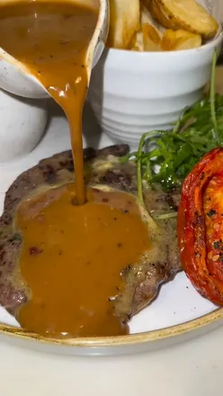 Cosy Ring O' Bells pub in Ormskirk, serving gourmet dishes like Scotch egg, kebabs, and ribeye steak.