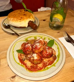 Delicious veal meatballs and prawns in crust at Eat My Pizza, Leytonstone—hearty starters in a cozy East London eatery.