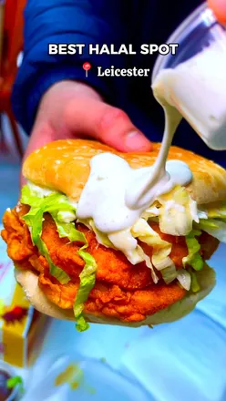 Alt text: "Delicious halal burgers and pizzas from MunchOut in Leicester, featuring chicken, beef, and loaded fries.